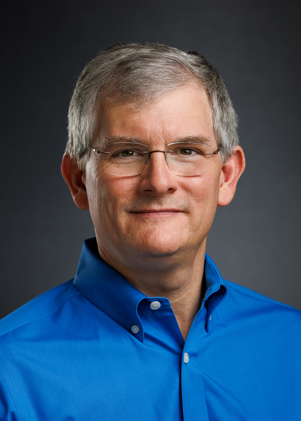 Top Scroll mens headshot